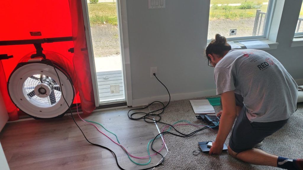 HERS Rater performing a blower door test.